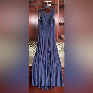 Navy blue fully lined ballgown with cutouts covered with navy, sheer mesh.